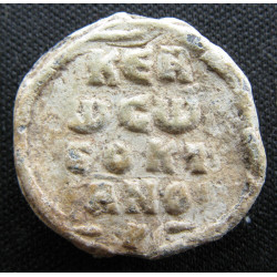 Théoktistos, protonotaire. Sceau byzantin en plomb (Ø 20 mm, 5,19 g). IXᵉ siècle.